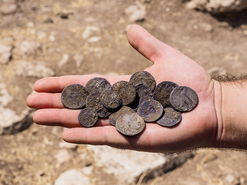 The cache of silver coins found at the estate house.